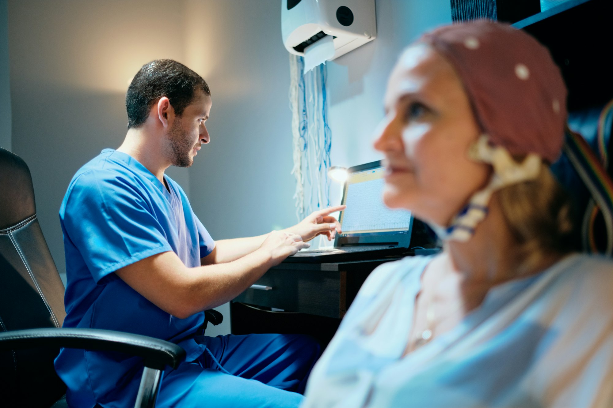 Doctor Doing Brain Medical Exam On Old Woman In Hospital