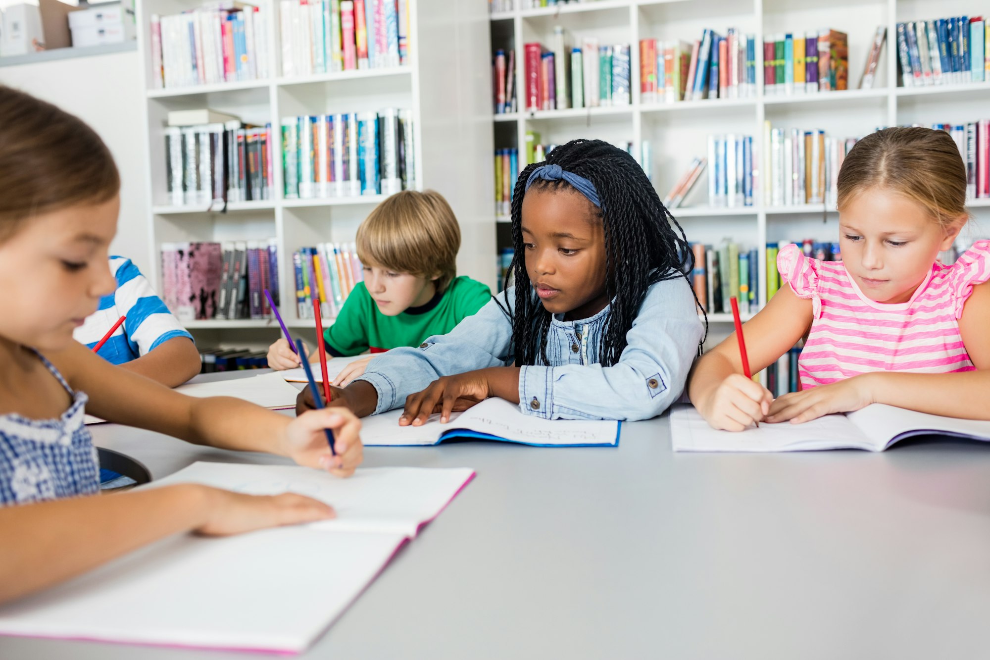 Front view of children coloring